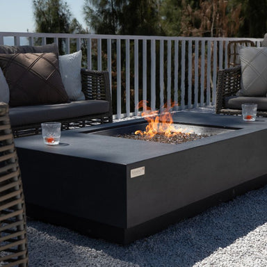 Elementi Plus Cannes Fire Table with flame and outdoor couch