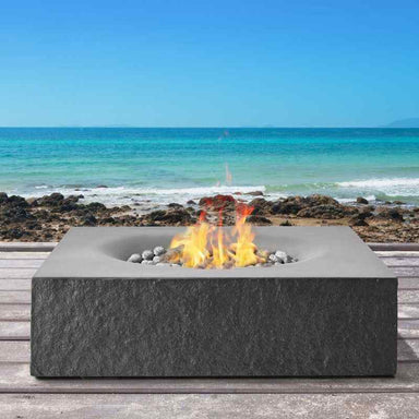 Pyromania Monument Fire Table Charcoal with ocean view Lifestyle