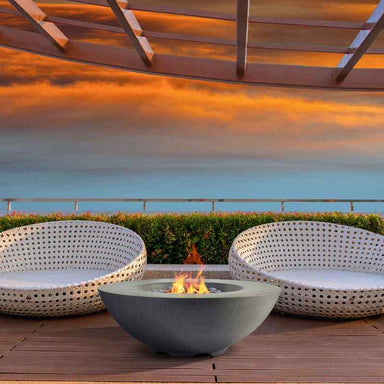 Pyromania Shangri-la Fire Table Slate with flame sunset view in a couch
