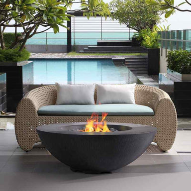Pyromania Shangri-la Fire Table charcoal near couch and pool